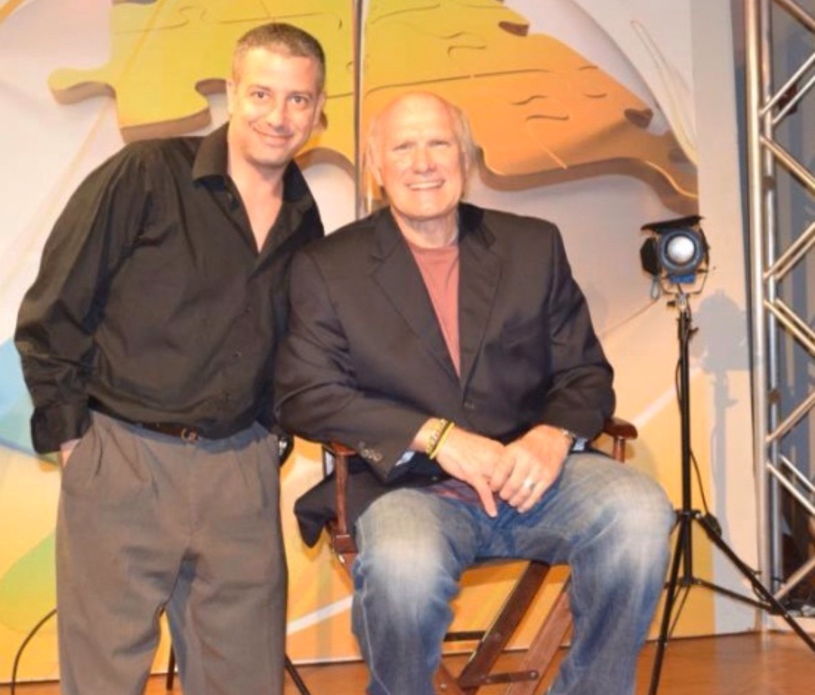 Spotlight Media founder with Terry Bradshaw on a production set