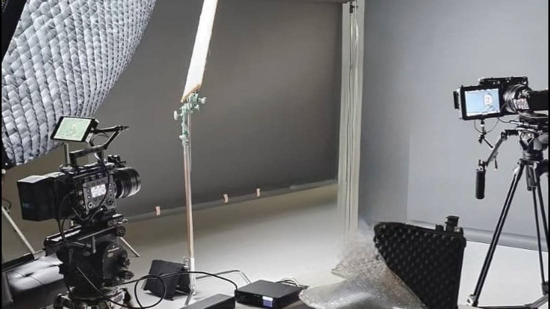 Camera crew filming a commercial on location