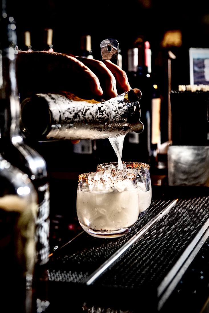 A signature cocktail poured on set for a bar brand