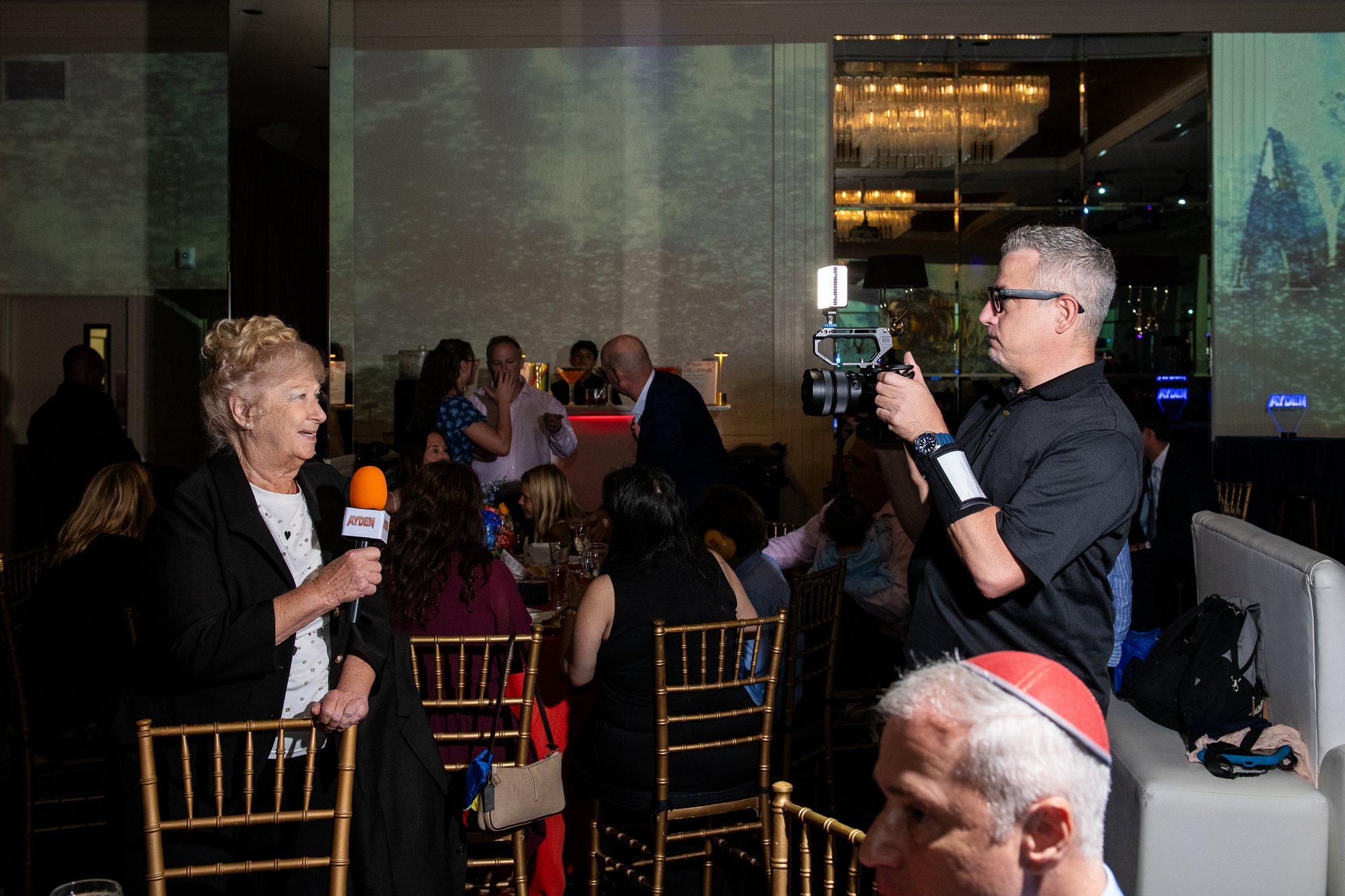 Capturing a guest's toast on camera during the reception